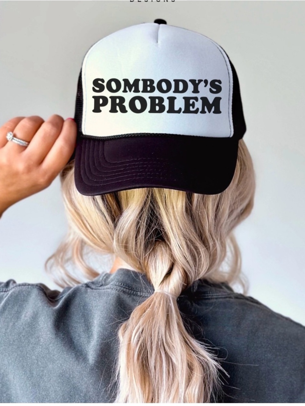 SOMBODY'S PROBLEM Black & White Trucker Hat
